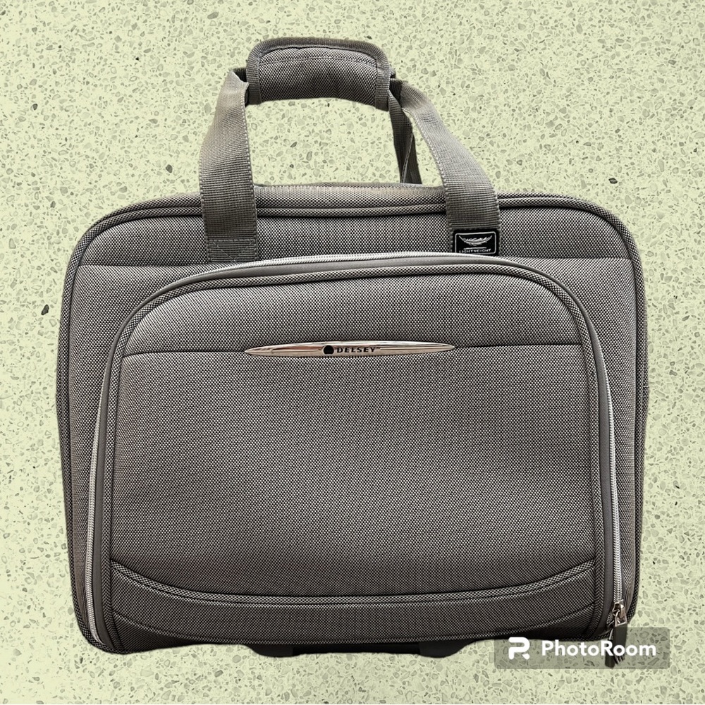 Delsey Silver Rolling Underseat Carryon Bag.